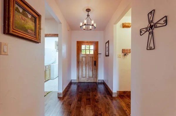a view of a hallway with windows