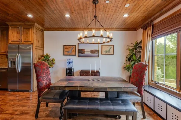 a view of a dining room with furniture window and outside view
