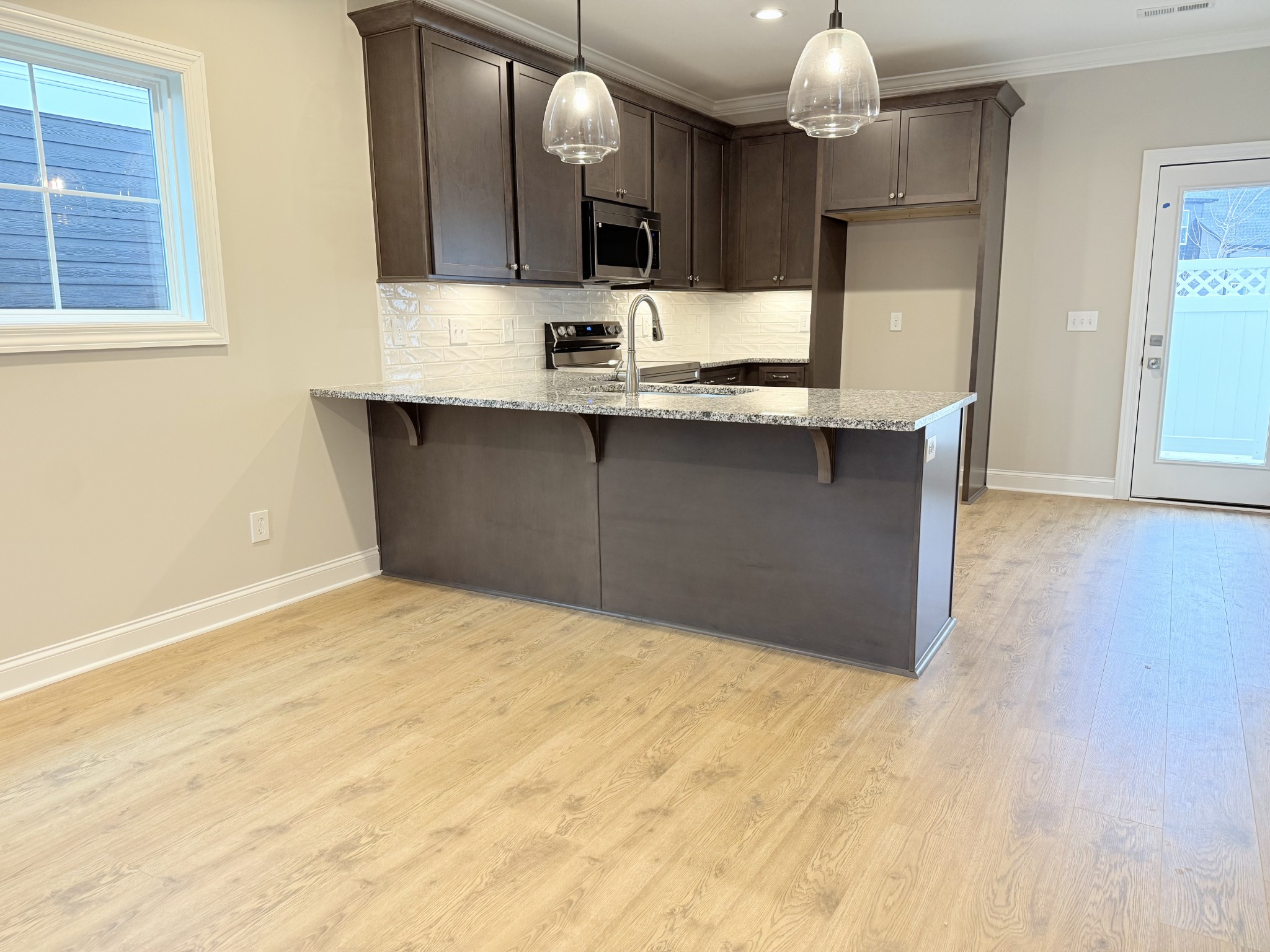 1367 Rebecca Johns Drive Murfreesboro, TN 37128 - Photo 13 of 32 a kitchen with granite countertop a sink and cabinets