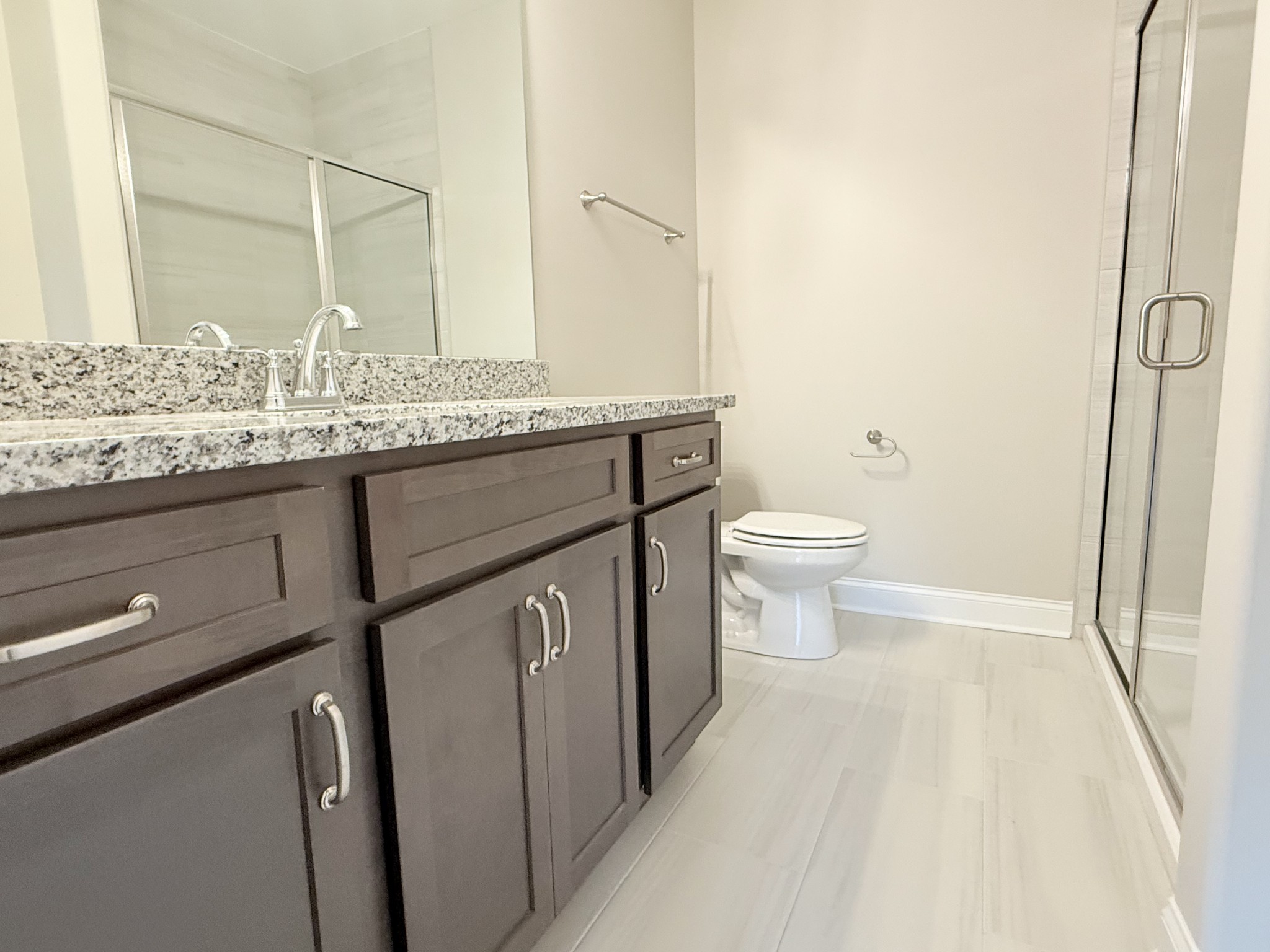 1367 Rebecca Johns Drive Murfreesboro, TN 37128 - Photo 5 of 32 a bathroom with a granite countertop sink toilet and shower