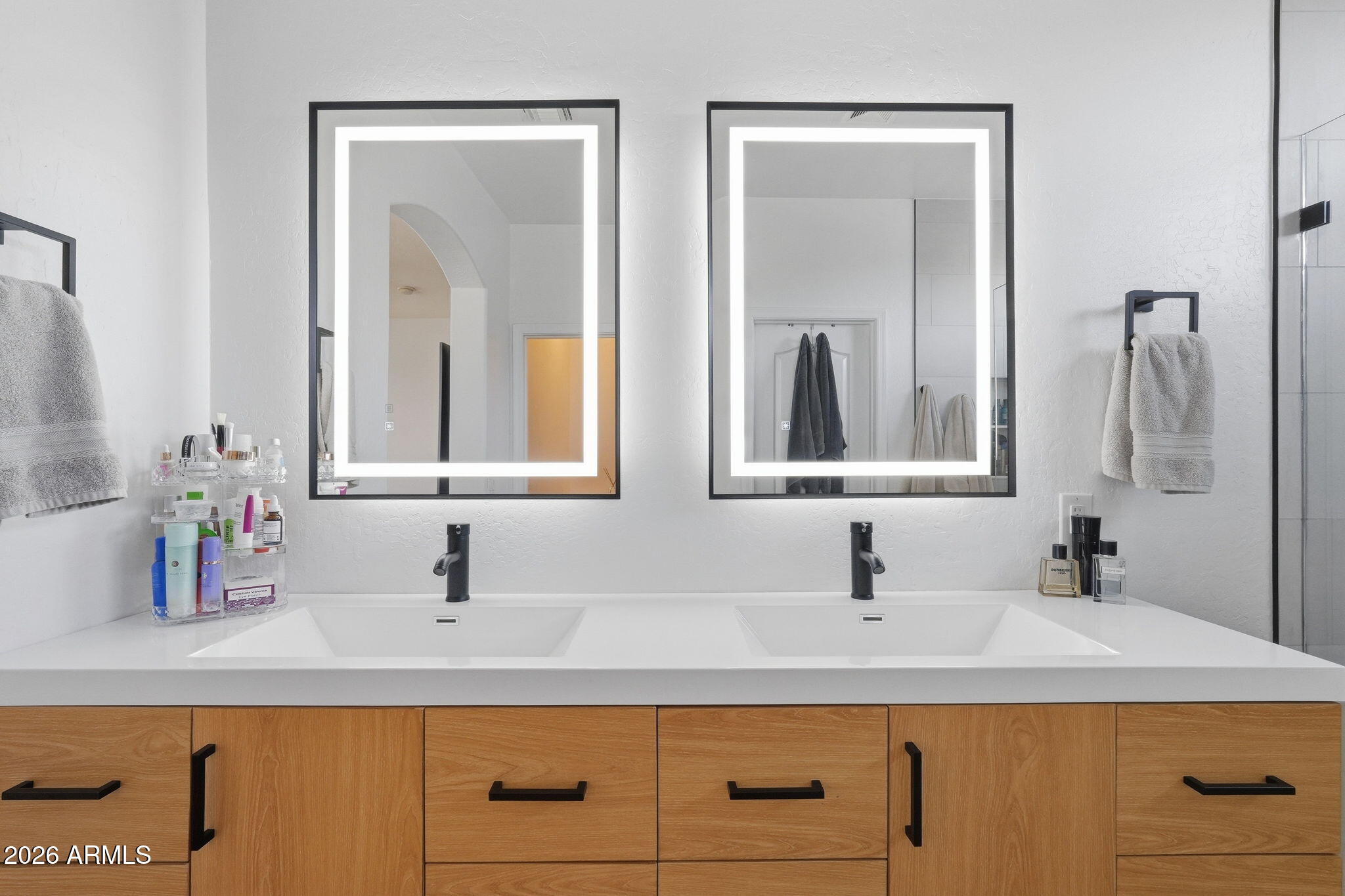 4184 East Trigger Way Gilbert, AZ 85297 - Photo 24 of 51 a bathroom with double vanity sinks and a mirror