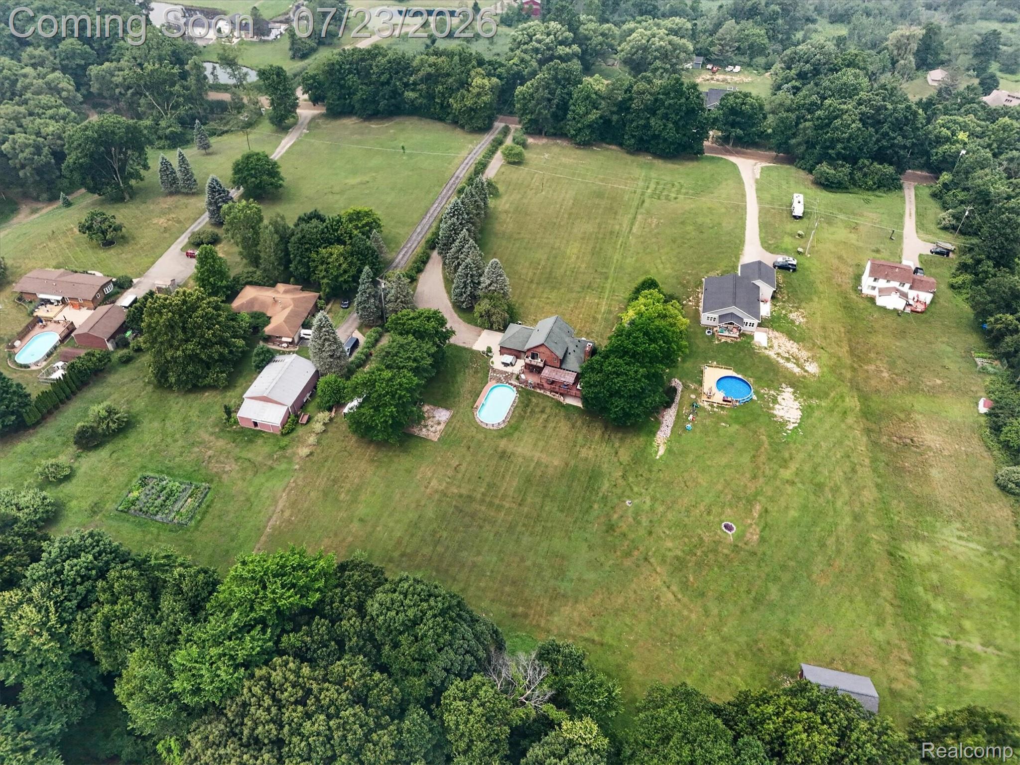 2795 Bird Road Ortonville, MI 48462 - Photo 55 of 62 Expansive acreage featuring multiple residences, mature trees, and two in-ground swimming pools