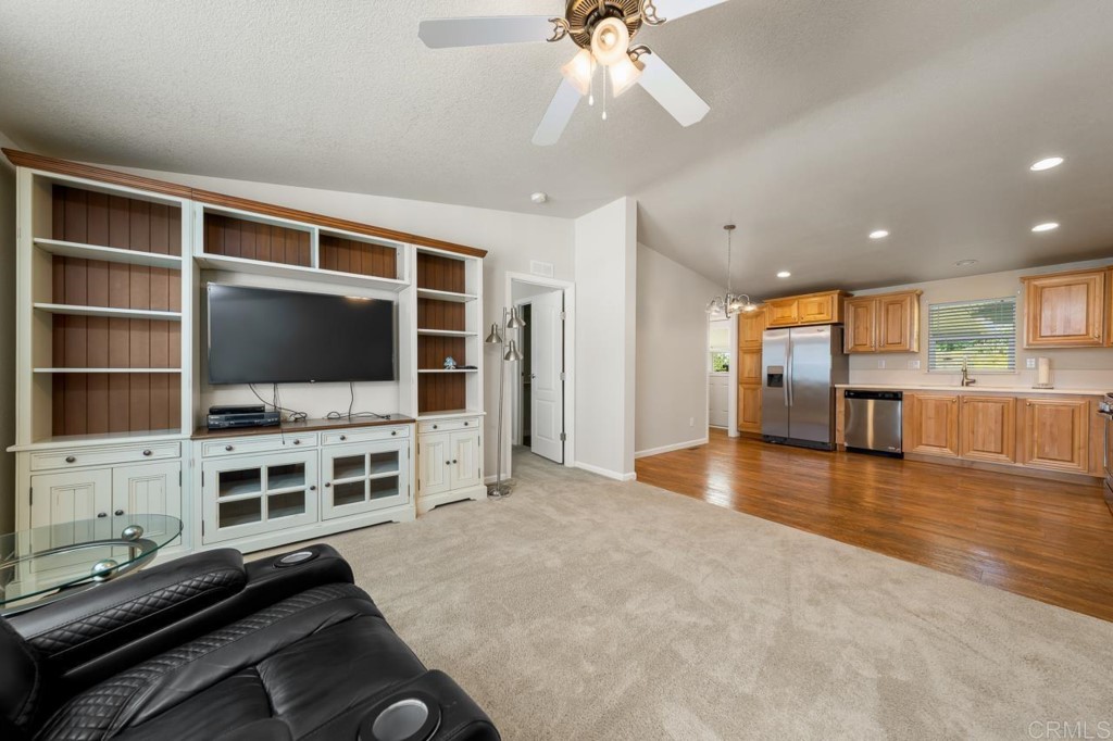 2400 Alpine Boulevard, Unit SPC 155 Alpine, CA 91901 - Photo 2 of 15 a view of a livingroom with workspace and a flat screen tv