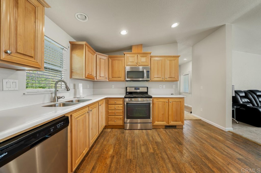 2400 Alpine Boulevard, Unit SPC 155 Alpine, CA 91901 - Photo 6 of 15 a kitchen with a sink a stove and cabinets