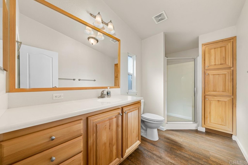 2400 Alpine Boulevard, Unit SPC 155 Alpine, CA 91901 - Photo 9 of 15 a bathroom with a sink a toilet a large mirror and shower