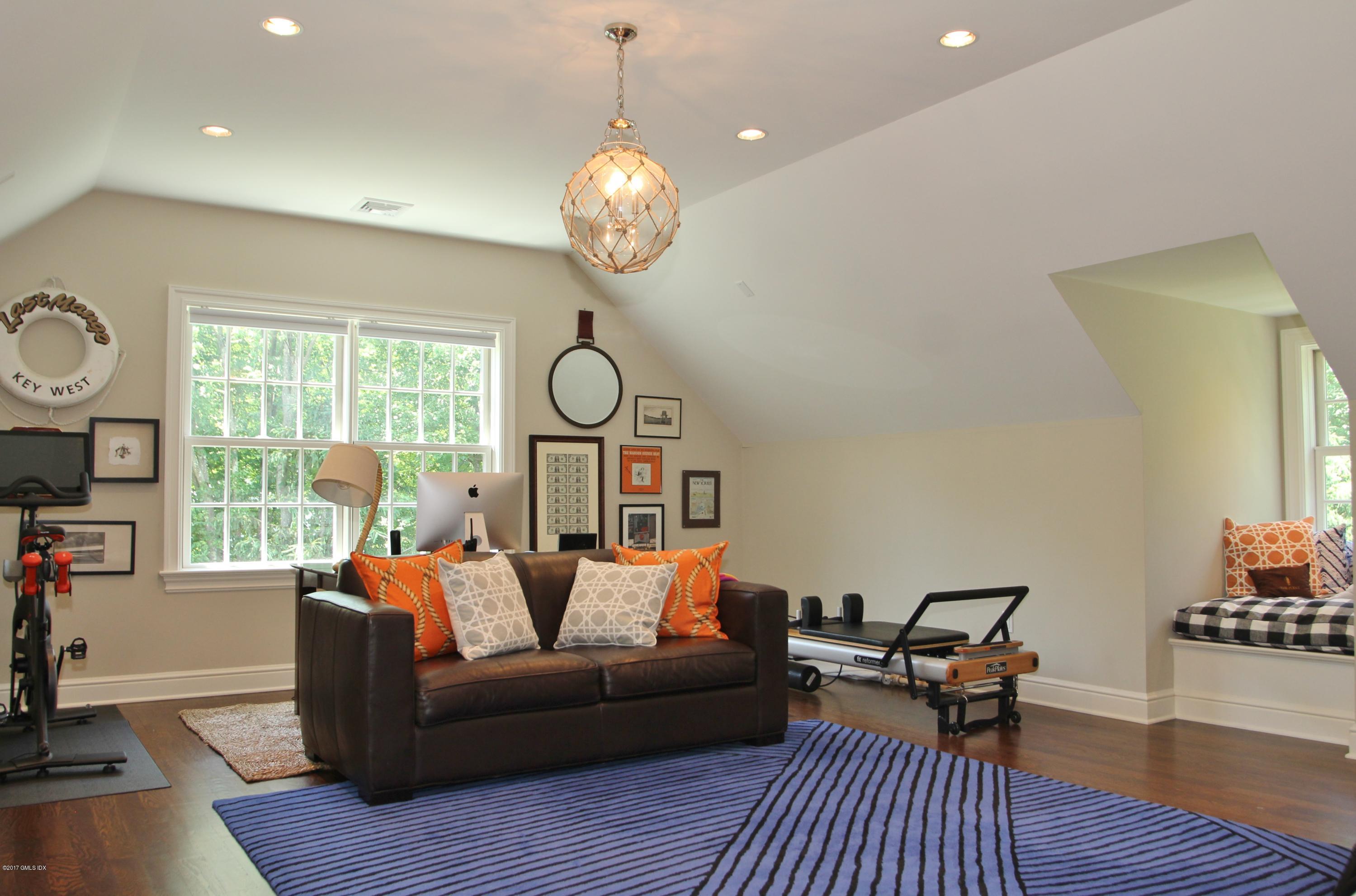 9 Roberta Lane Greenwich, CT 06830 - Photo 16 of 25 a living room with furniture and a large window