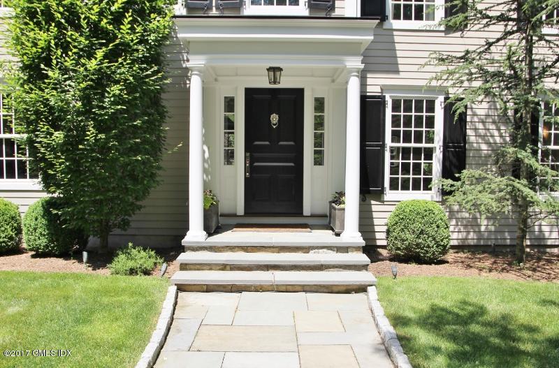 9 Roberta Lane Greenwich, CT 06830 - Photo 3 of 25 a front view of a house with a garden