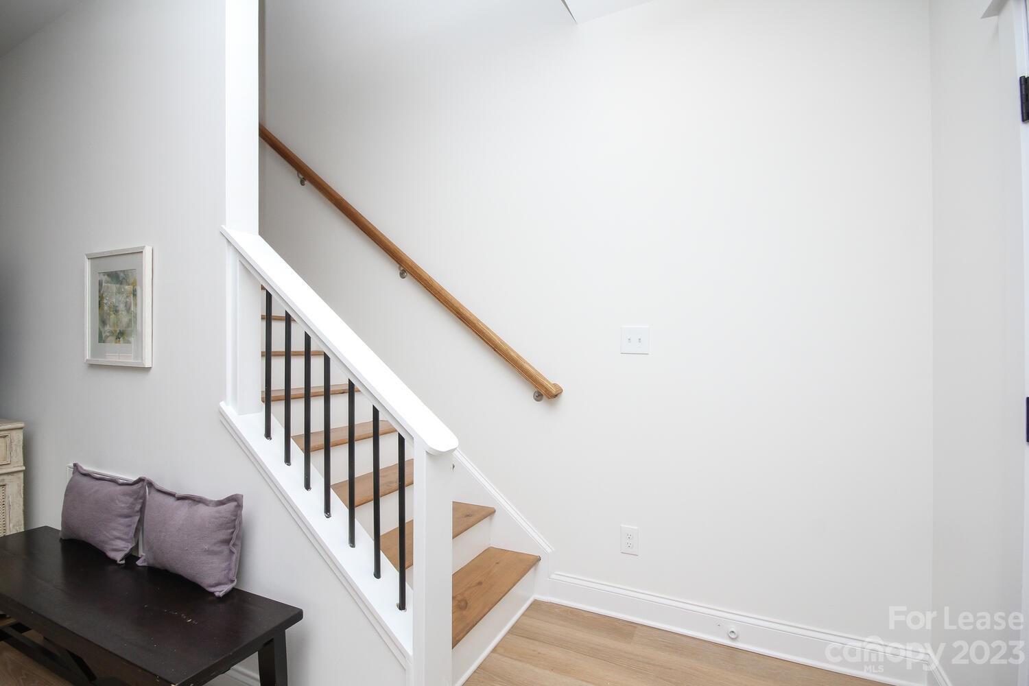 1082 Startown Road Lincolnton, NC 28092 - Photo 20 of 48 a view of staircase with wooden floor and white walls