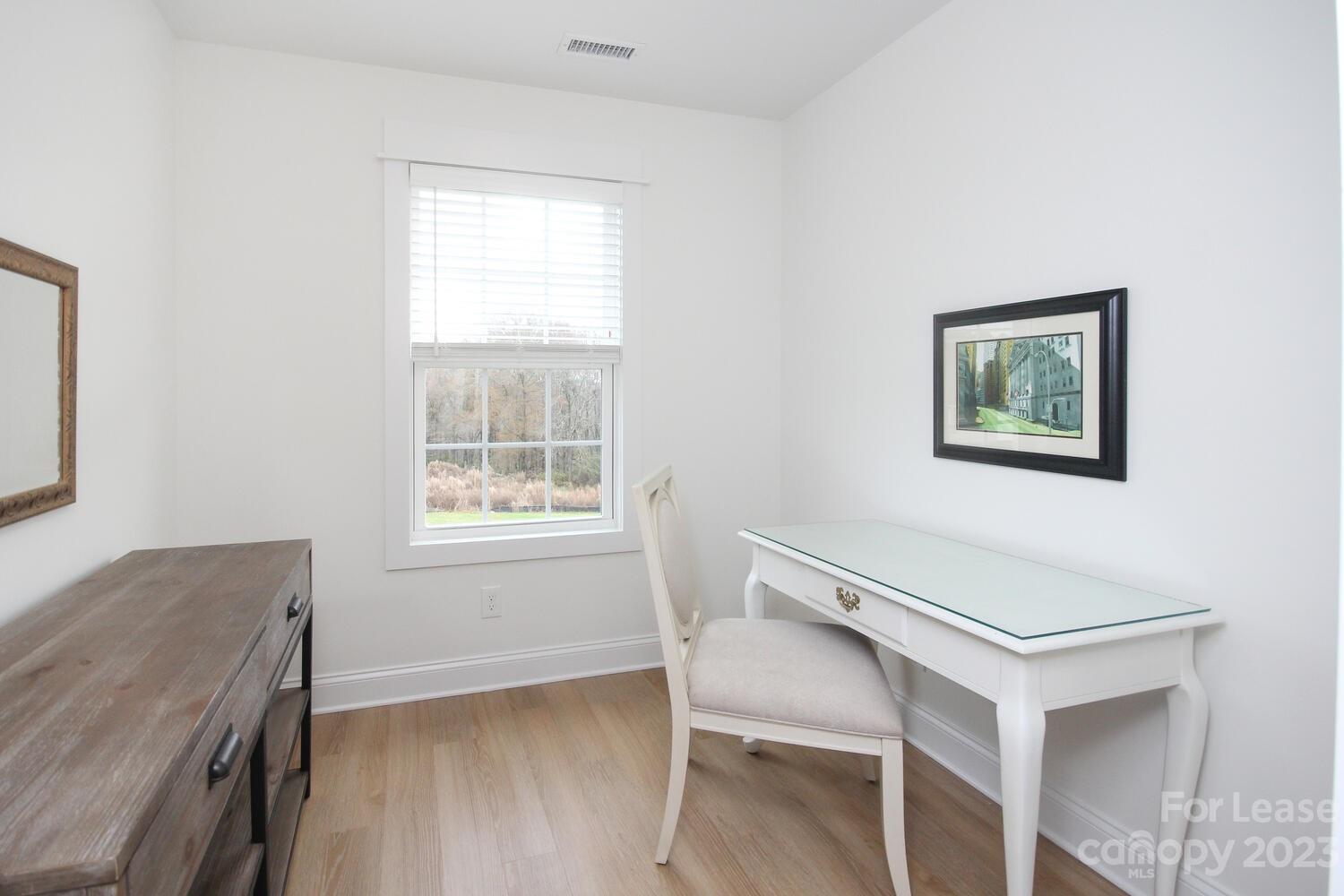 1082 Startown Road Lincolnton, NC 28092 - Photo 22 of 48 a view of a workspace with furniture and a window