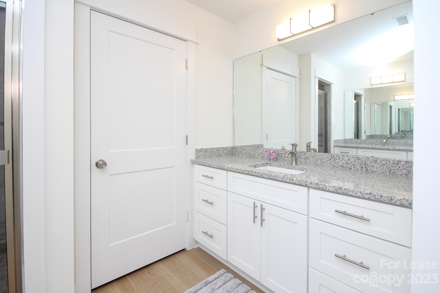 1082 Startown Road Lincolnton, NC 28092 - Photo 29 of 48 a bathroom with a granite countertop sink and a mirror
