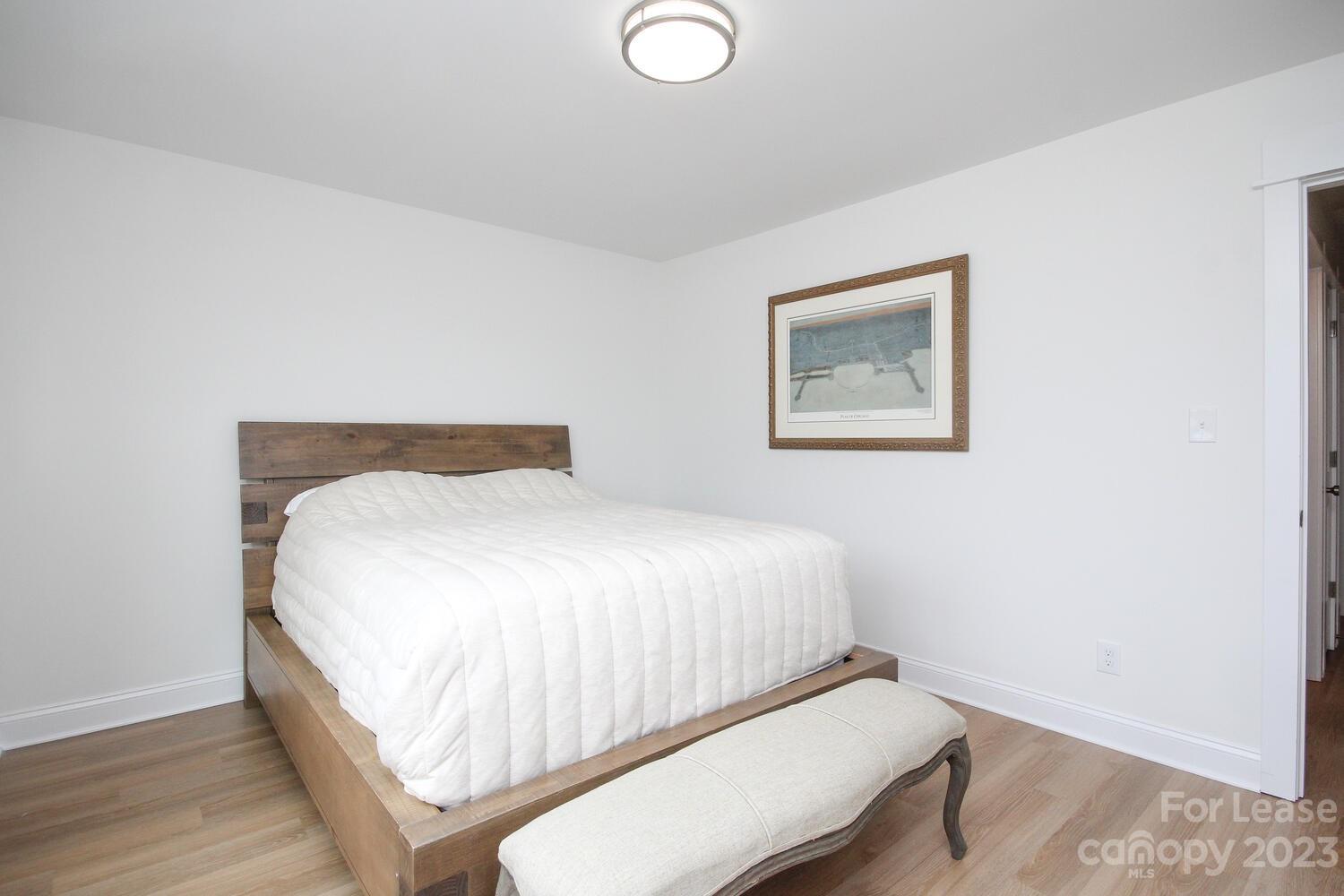 1082 Startown Road Lincolnton, NC 28092 - Photo 41 of 48 a bedroom with a bed and painting on the wall