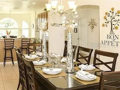 a dining room with furniture and wooden floor