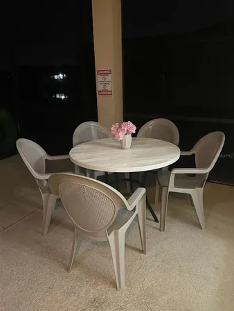 a view of an chairs and tables in the patio