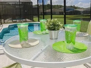 a view of a swimming pool with a patio