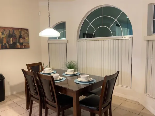 a view of a dining table and chairs in the room