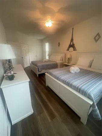 a living room with hard wood flooring and couch