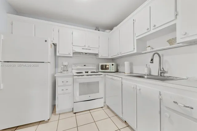 a bedroom with a bed and a cabinets