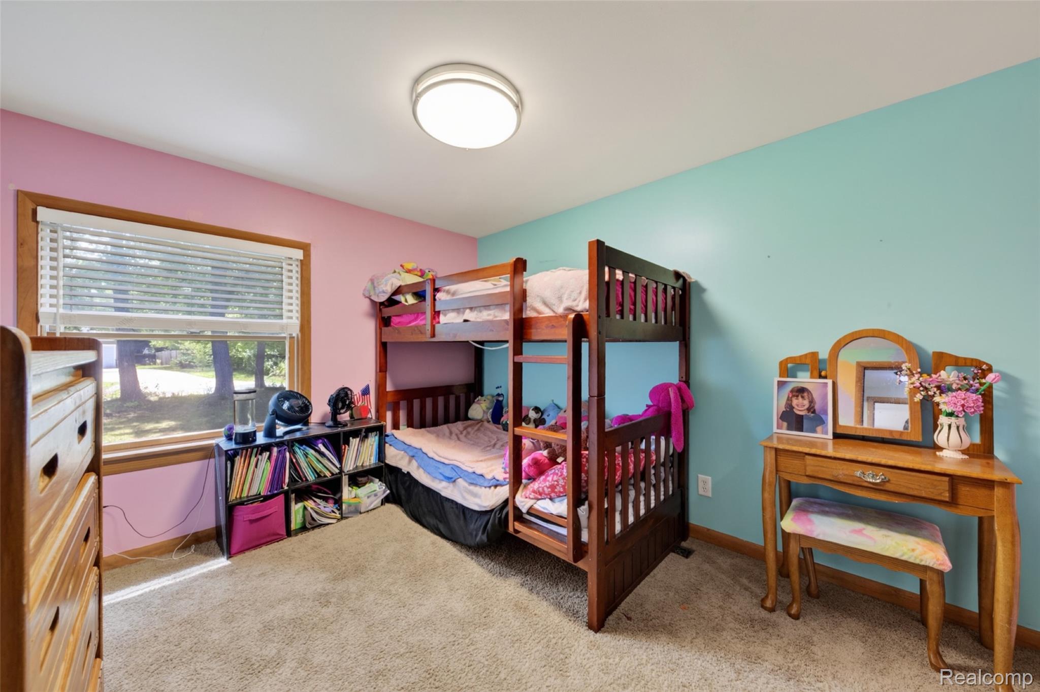 7447 Ore Lake Road Brighton, MI 48116 - Photo 26 of 45 Carpeted room featuring a large window with blinds and wood trim