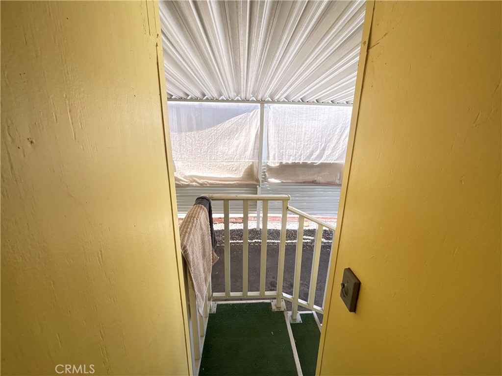 31130 South General Kearny Road, Unit 172 Temecula, CA 92591 - Photo 4 of 49 Side door to carport