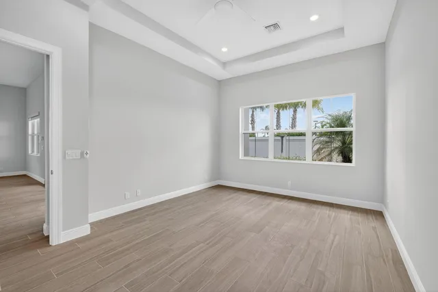 an aerial view of residential houses with outdoor space and swimming pool