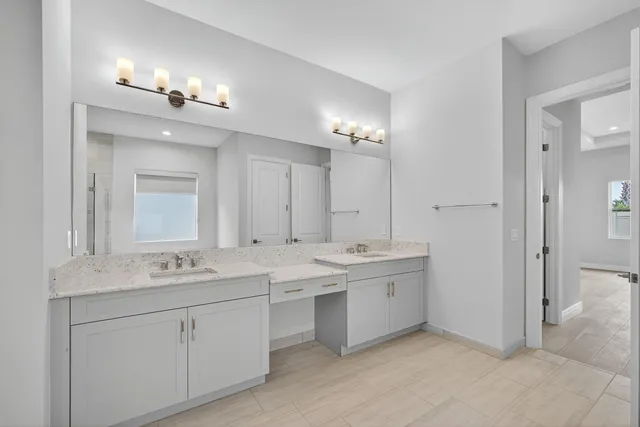 a view of a swimming pool with a chairs and plants