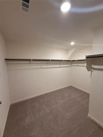 a view of a room with racks on the wall