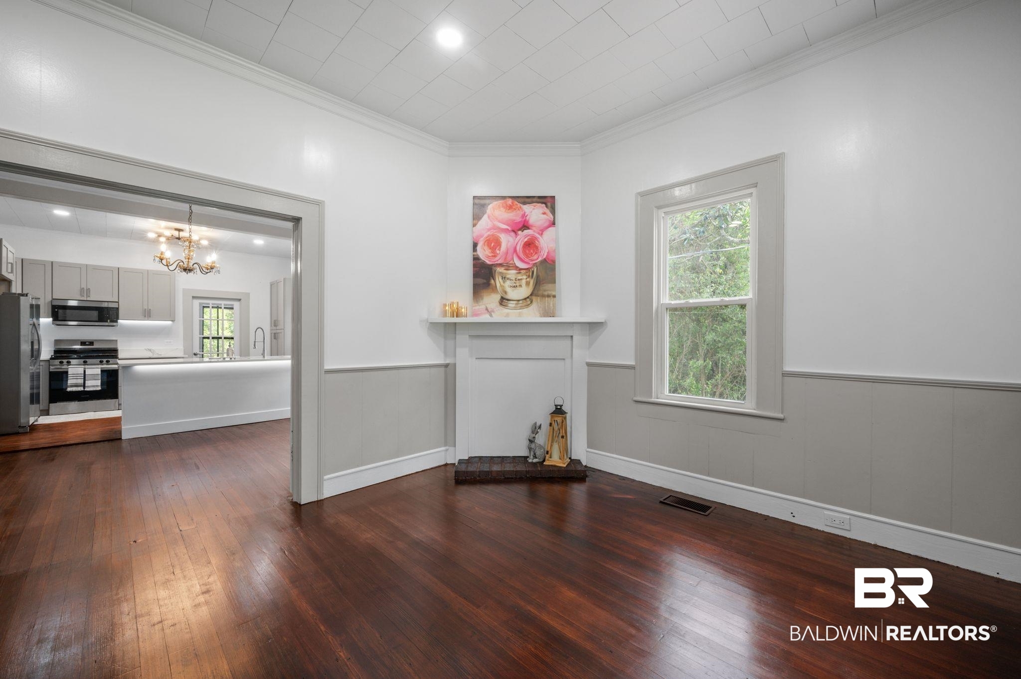 733 Pineville Road Monroeville, AL 36460 - Photo 4 of 68 Unfurnished living room featuring plenty of natural light, visible vents, dark wood finished floors, and a chandelier