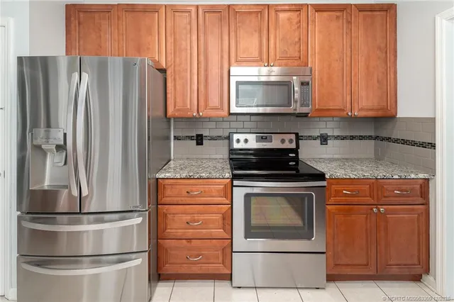 a kitchen with appliances and cabinets