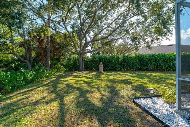 a view of a swimming pool with a yard