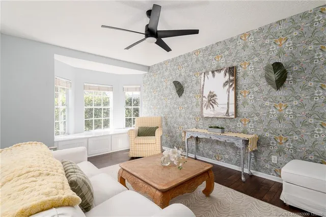 a living room with furniture and a window