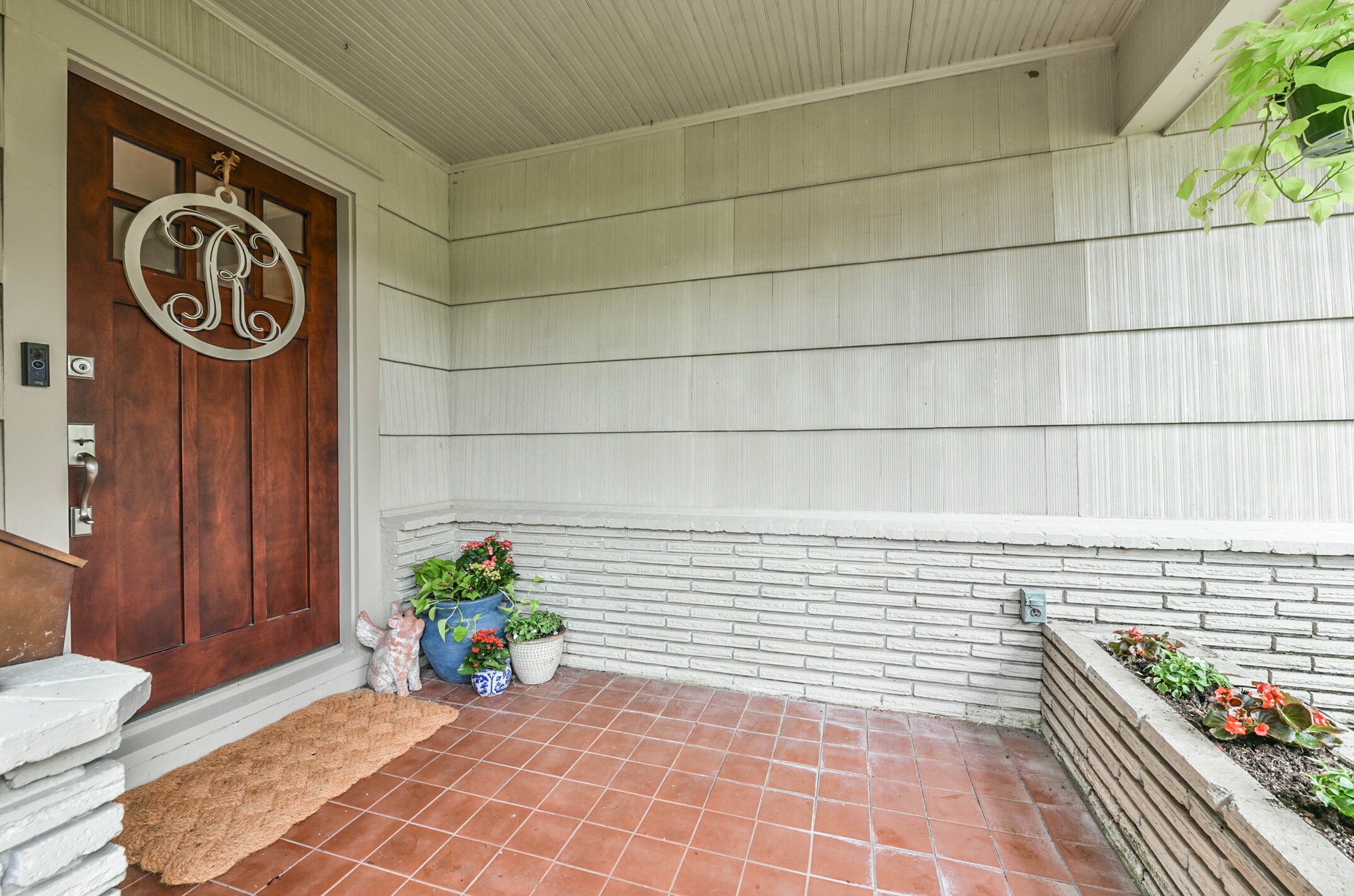 906 Bay Oaks Road Houston, TX 77008 - Photo 4 of 26 Welcoming front porch with brick accents and lovely landscaping.