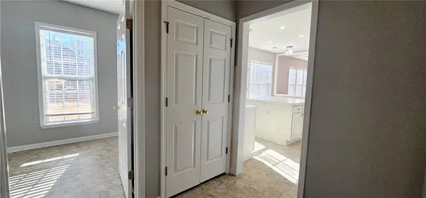 a view of closet with wooden floor