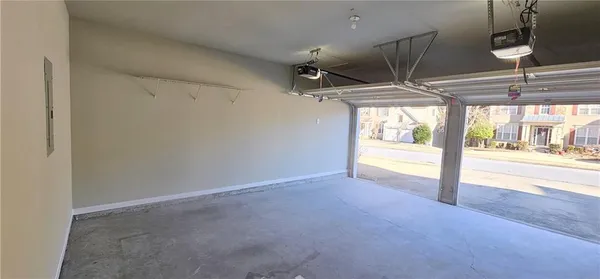 an aerial view of a house with garden space and patio