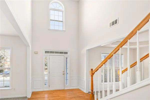 a view of a room with window ceiling fan and windows