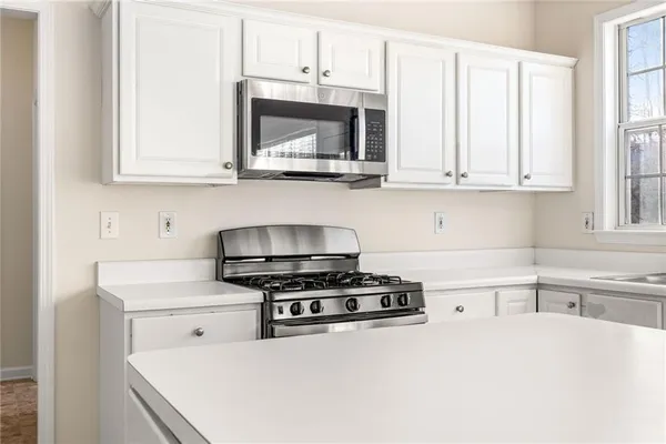 a bathroom with a sink a vanity and a window