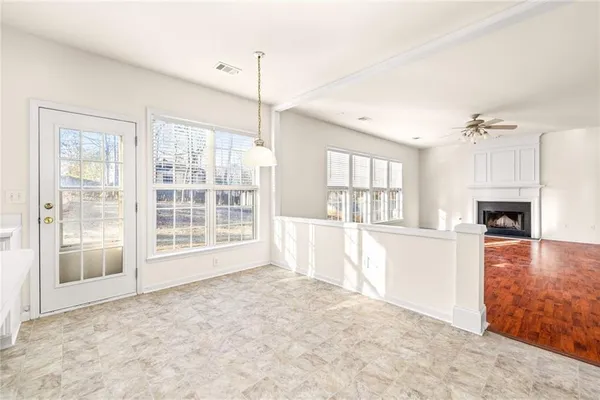 a view of hallway with wooden floor