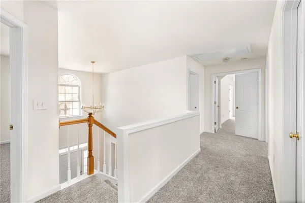a spacious bathroom with a granite countertop sink mirror and a bathtub