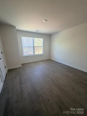 a bathroom with a granite countertop sink a toilet and a tub