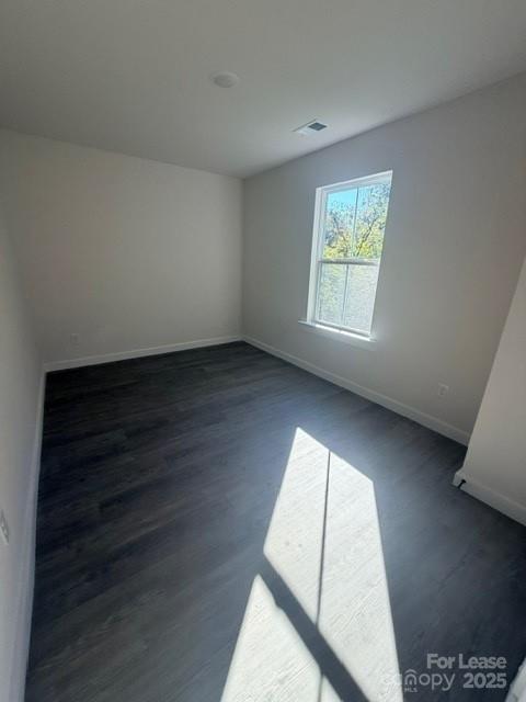 405 15th Avenue Southwest Hickory, NC 28602 - Photo 10 of 11 an empty room with wooden floor and windows