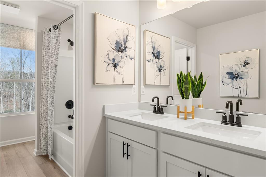 236 Black Walnut Way Canton, GA 30114 - Photo 17 of 22 a bathroom with a sink a mirror a vanity and a shower