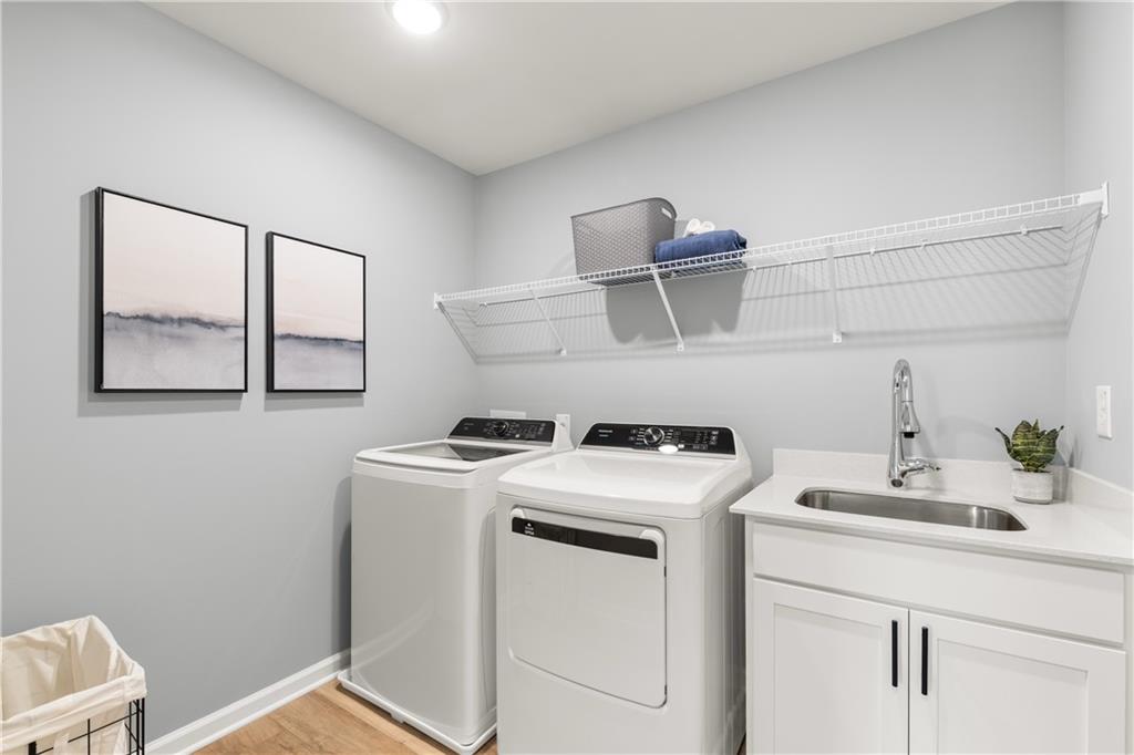 236 Black Walnut Way Canton, GA 30114 - Photo 18 of 22 a utility room with dryer and washer