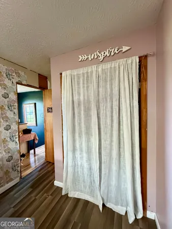 a view of a room with wooden floor and couch