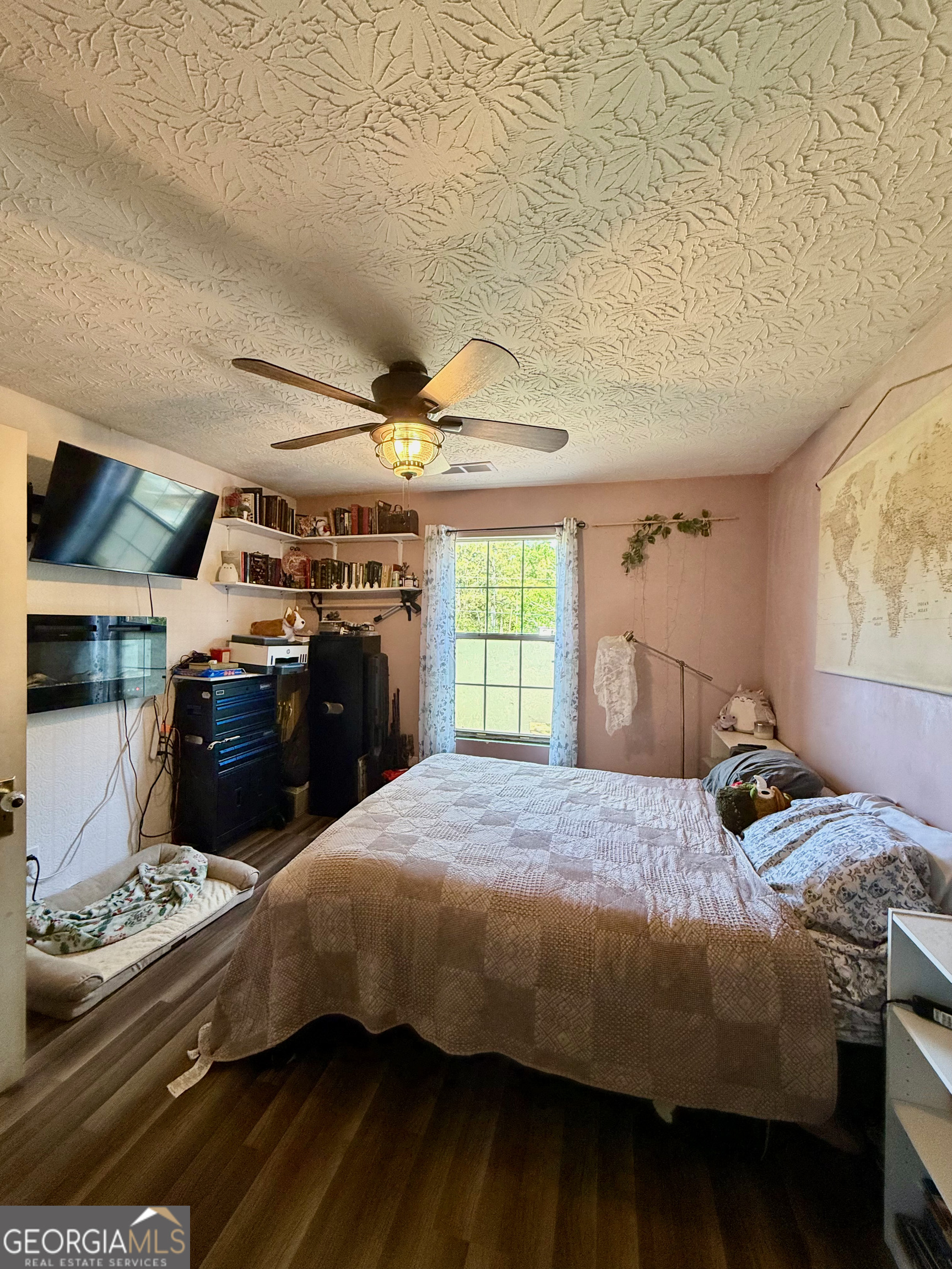 1449 Price Bridge Road Lyerly, GA 30730 - Photo 15 of 32 a bedroom with a bed and a tv