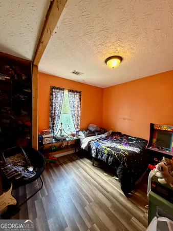 a bedroom with bed or couch and a window