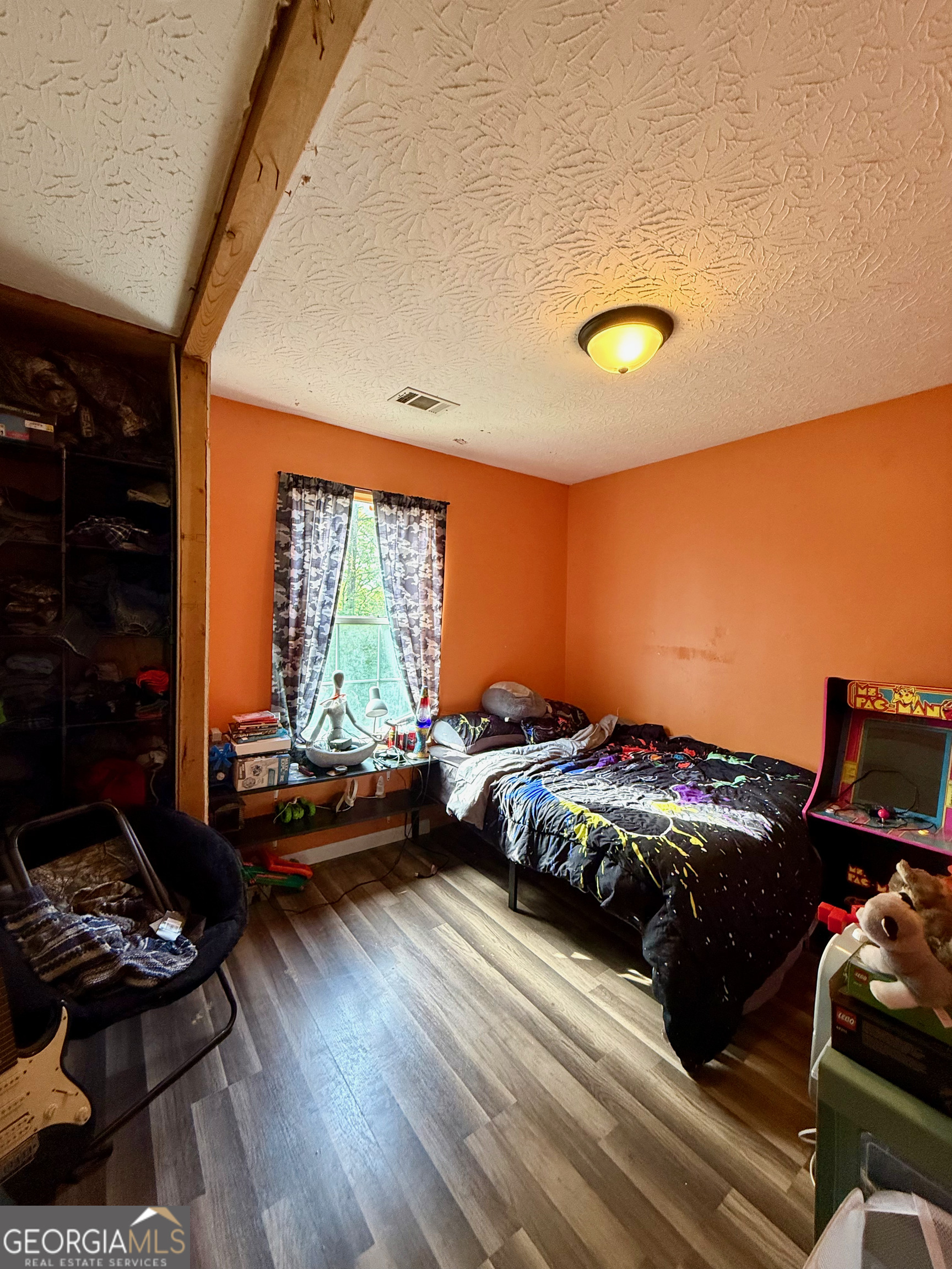 1449 Price Bridge Road Lyerly, GA 30730 - Photo 18 of 32 a bedroom with bed or couch and a window
