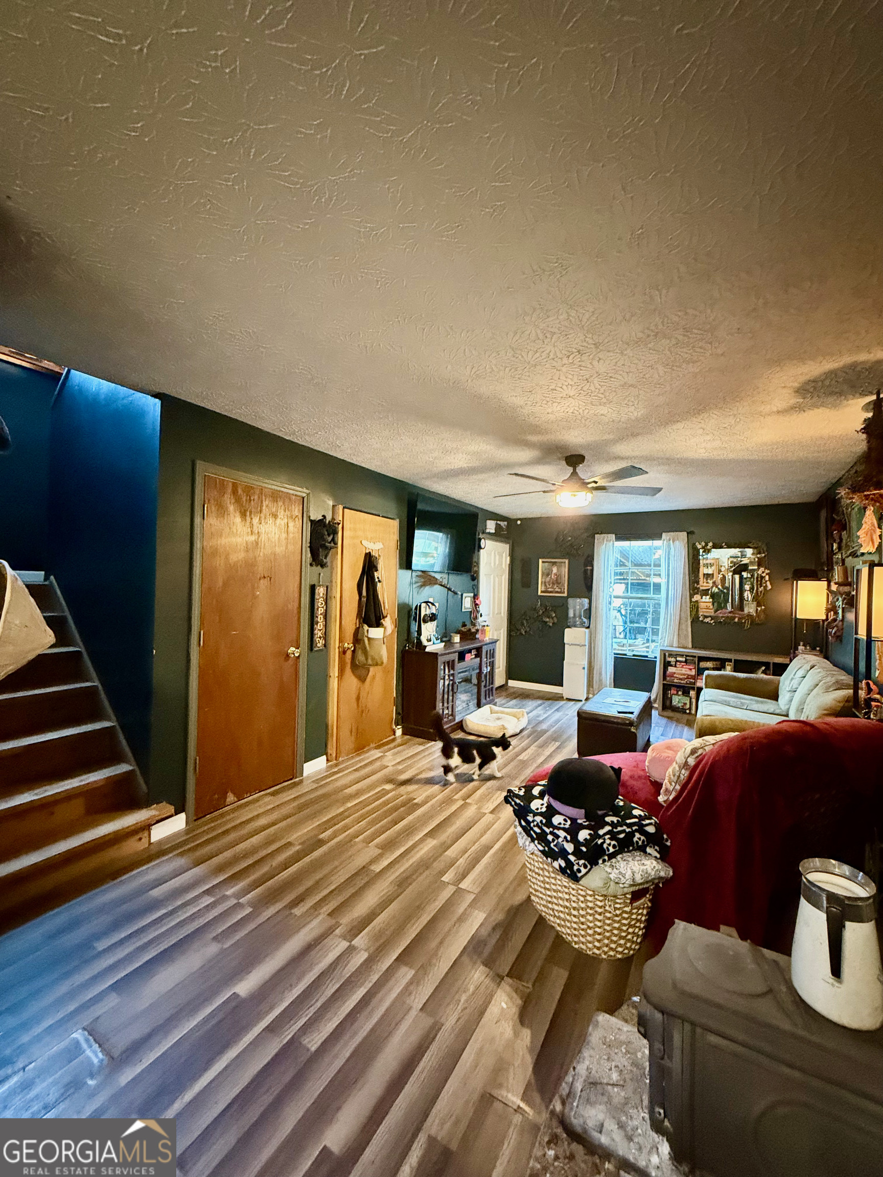 1449 Price Bridge Road Lyerly, GA 30730 - Photo 2 of 32 a room with furniture or couch and a fireplace