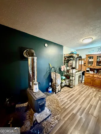 a room with lots of chairs and a wooden floor