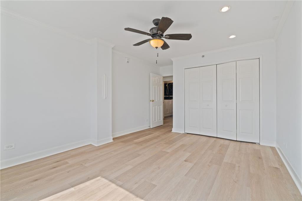 1501 Clairmont Road, Unit 1731 Decatur, GA 30033 - Photo 22 of 30 a view of empty room with wooden floor and ceiling fan