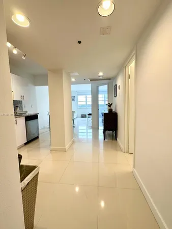 a view of a living room with furniture and a flat screen tv