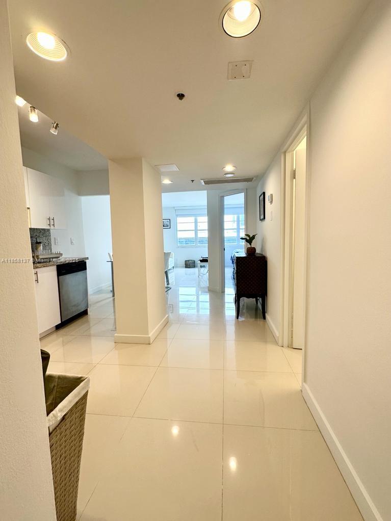 100 Lincoln Road, Unit 1406 Miami Beach, FL 33139 - Photo 8 of 14 a view of a living room with furniture and a flat screen tv